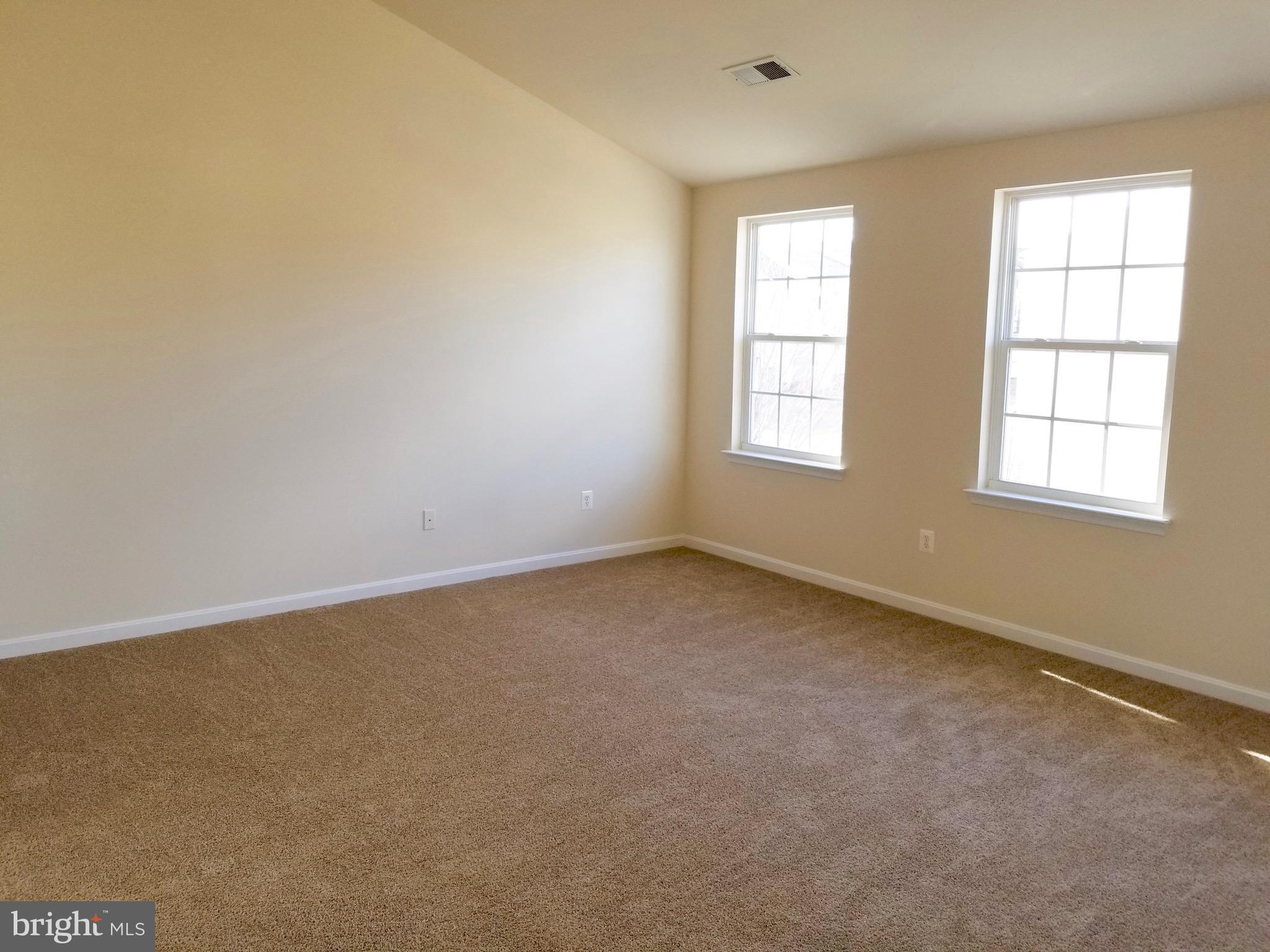 54 Watercourse Drive Ranson, WV 25438 - Photo 16 of 30 an empty room with windows