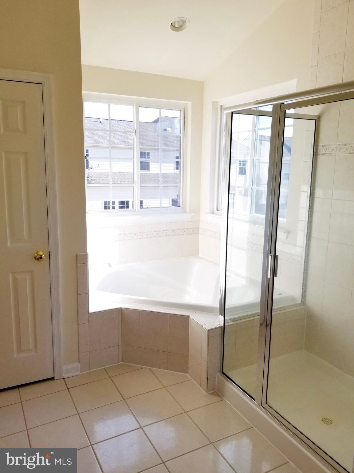 54 Watercourse Drive Ranson, WV 25438 - Photo 18 of 30 a bathroom with a bathtub and a shower
