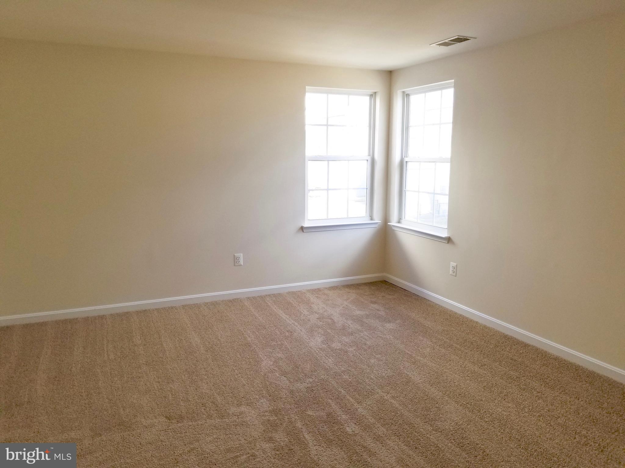 54 Watercourse Drive Ranson, WV 25438 - Photo 20 of 30 an empty room with windows