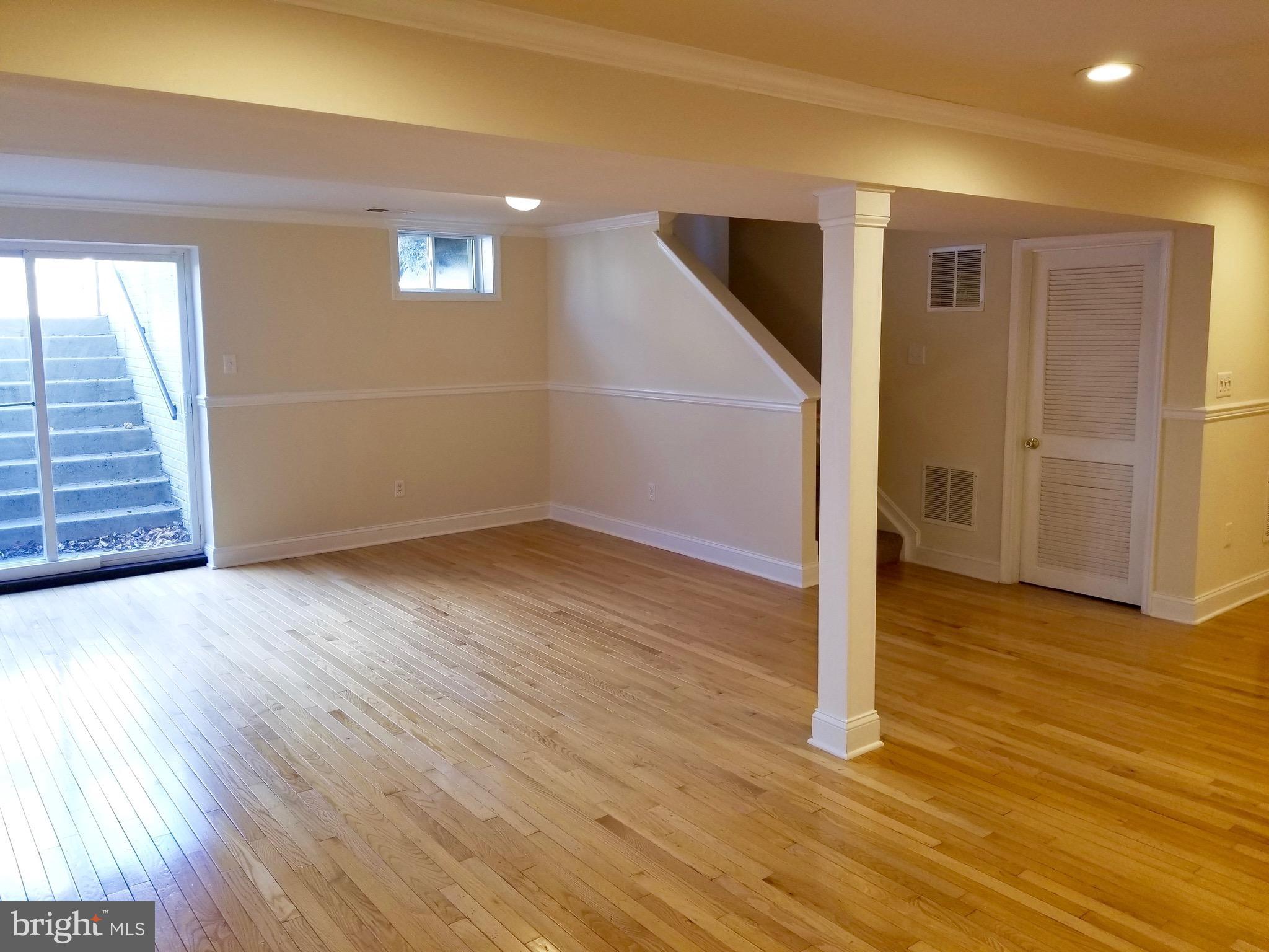 54 Watercourse Drive Ranson, WV 25438 - Photo 28 of 30 an empty room with wooden floor and entryway
