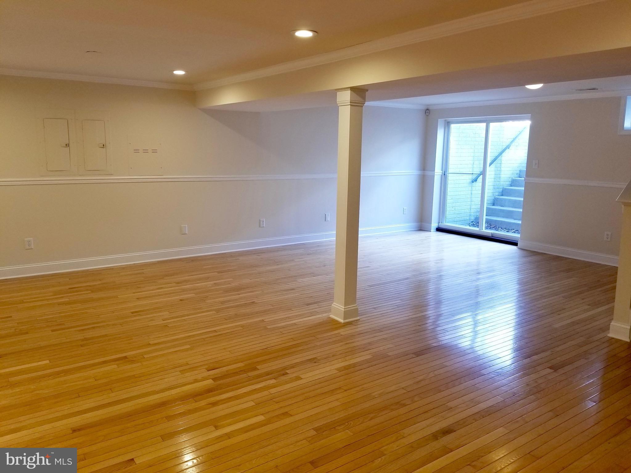 54 Watercourse Drive Ranson, WV 25438 - Photo 29 of 30 a view of an empty room with wooden floor and a window