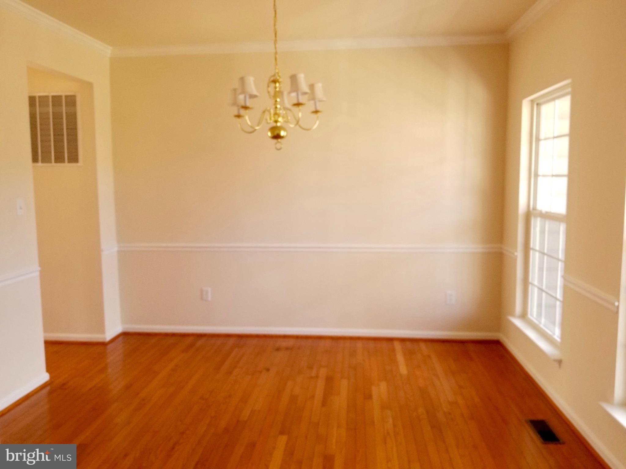54 Watercourse Drive Ranson, WV 25438 - Photo 6 of 30 a view of a room with wooden floor and a window