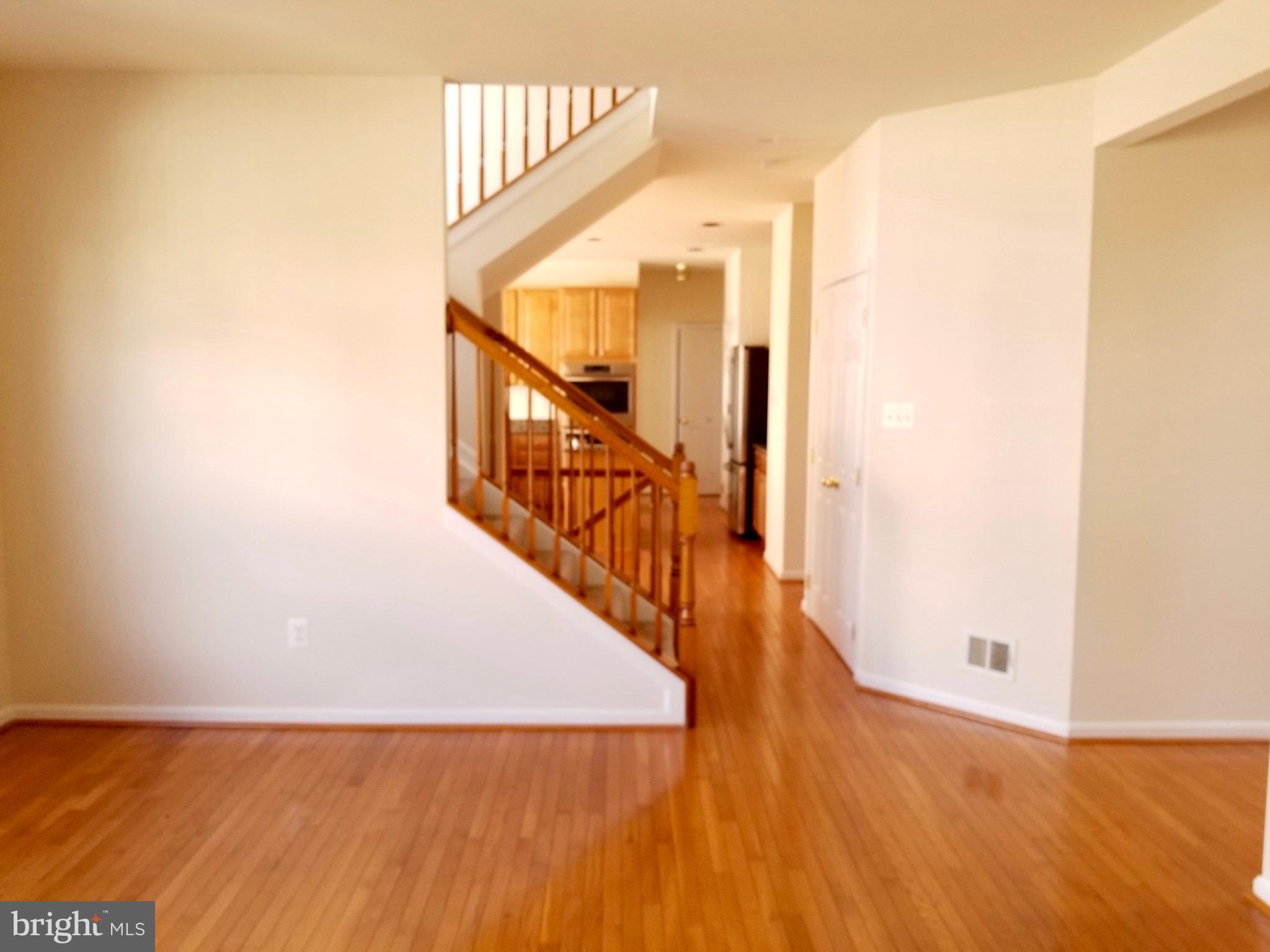 54 Watercourse Drive Ranson, WV 25438 - Photo 8 of 30 a view of a hallway with wooden floor