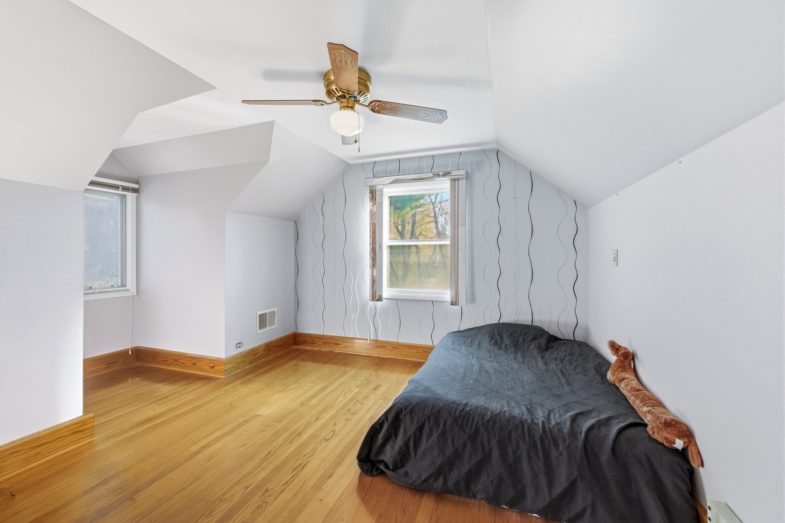 216 Edgebrook Road Wood Dale, IL 60191 - Photo 12 of 25 a bedroom with a bed and a window