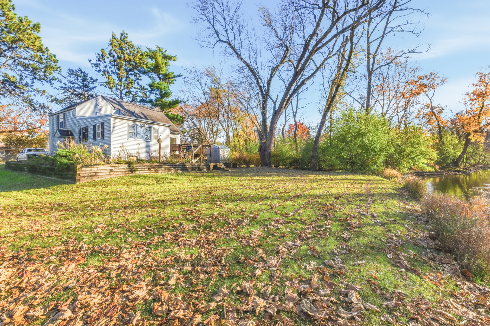 216 Edgebrook Road Wood Dale, IL 60191 - Photo 20 of 25 a view of a house with a big yard and large trees