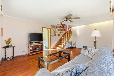 a bedroom with furniture and a flat screen tv