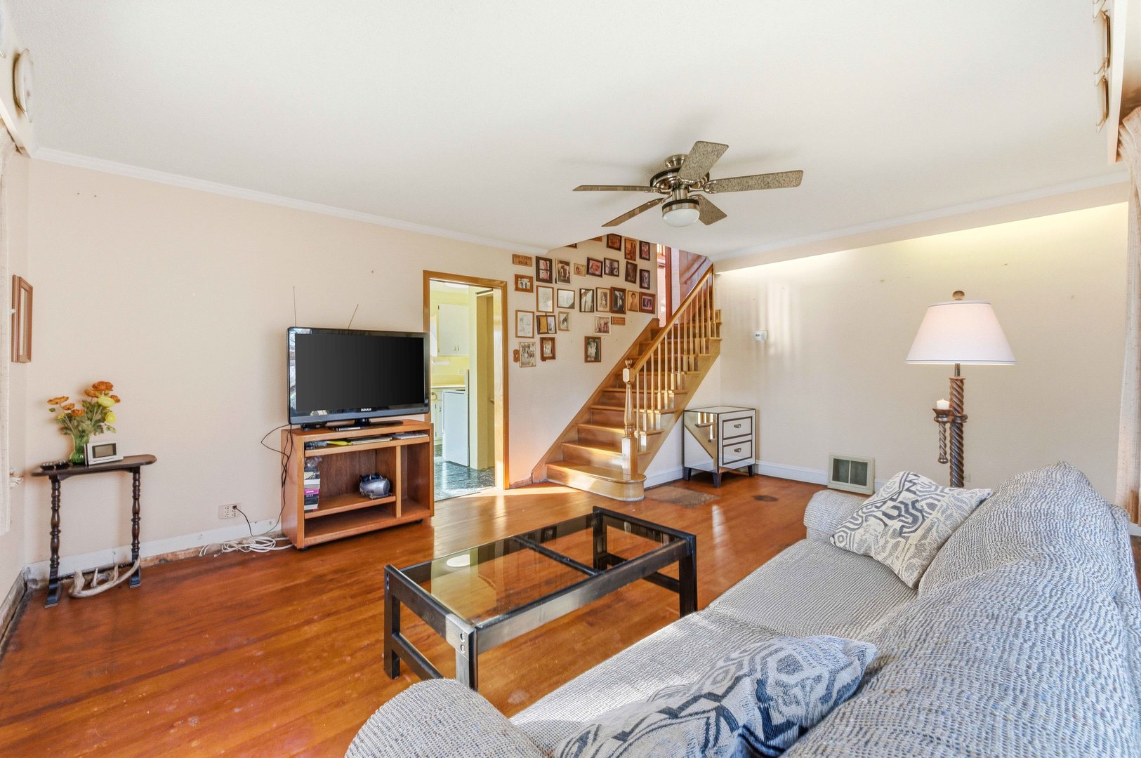 216 Edgebrook Road Wood Dale, IL 60191 - Photo 3 of 25 a bedroom with furniture and a flat screen tv