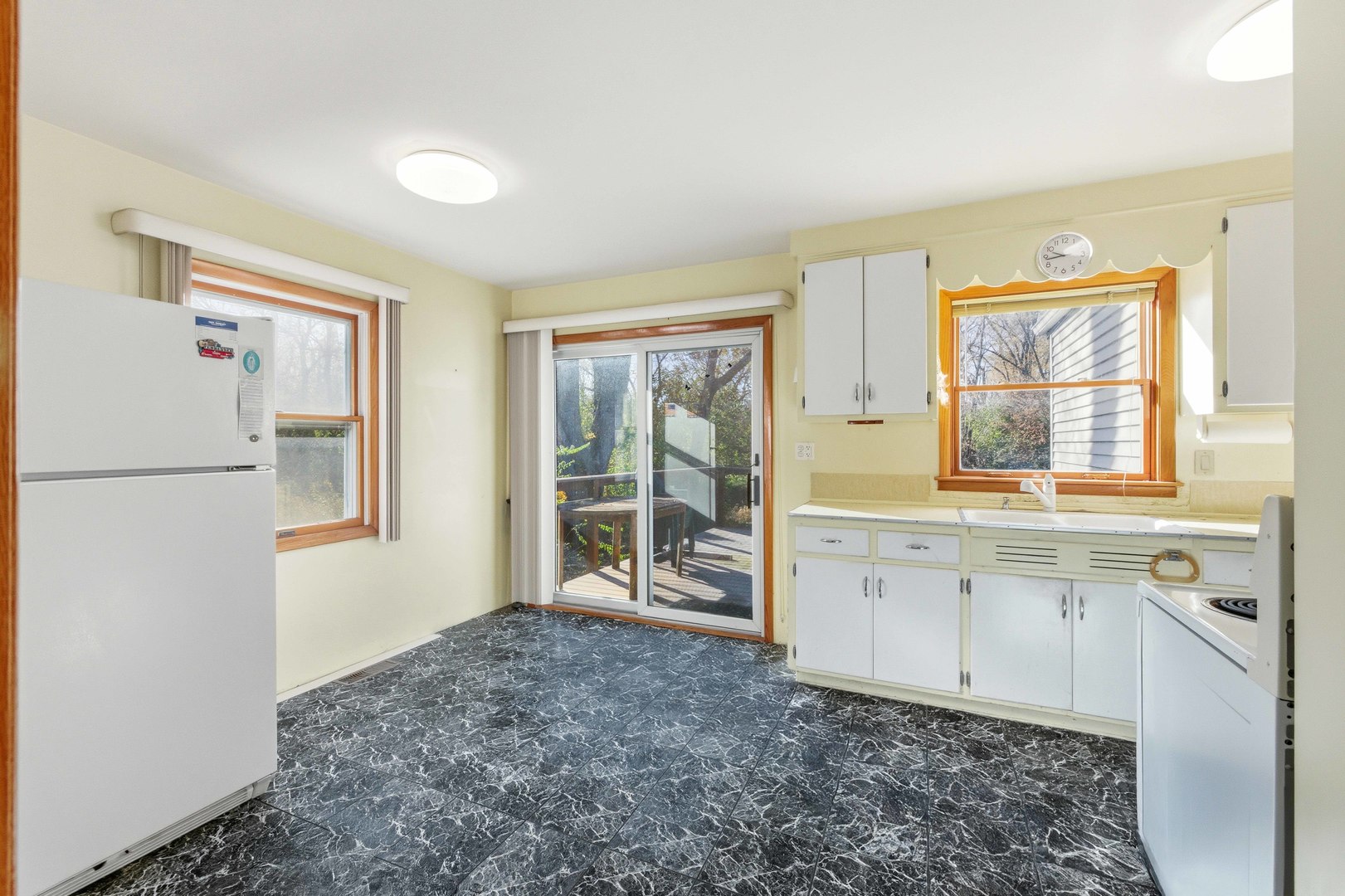 216 Edgebrook Road Wood Dale, IL 60191 - Photo 4 of 25 a spacious bathroom with a granite countertop sink and a window