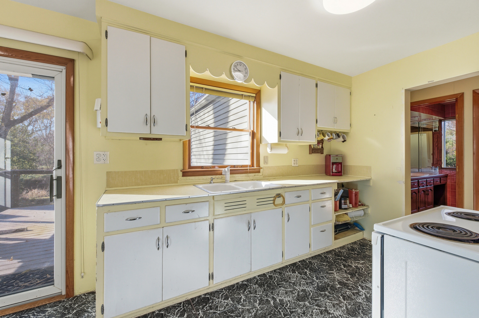 216 Edgebrook Road Wood Dale, IL 60191 - Photo 7 of 25 a kitchen with cabinets appliances and a window