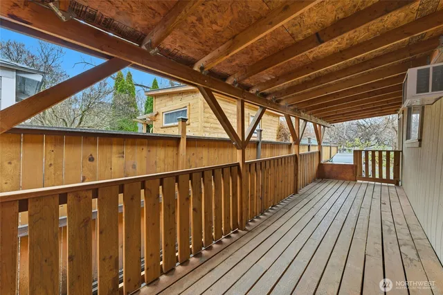 a view of a yard with a house and a large tree