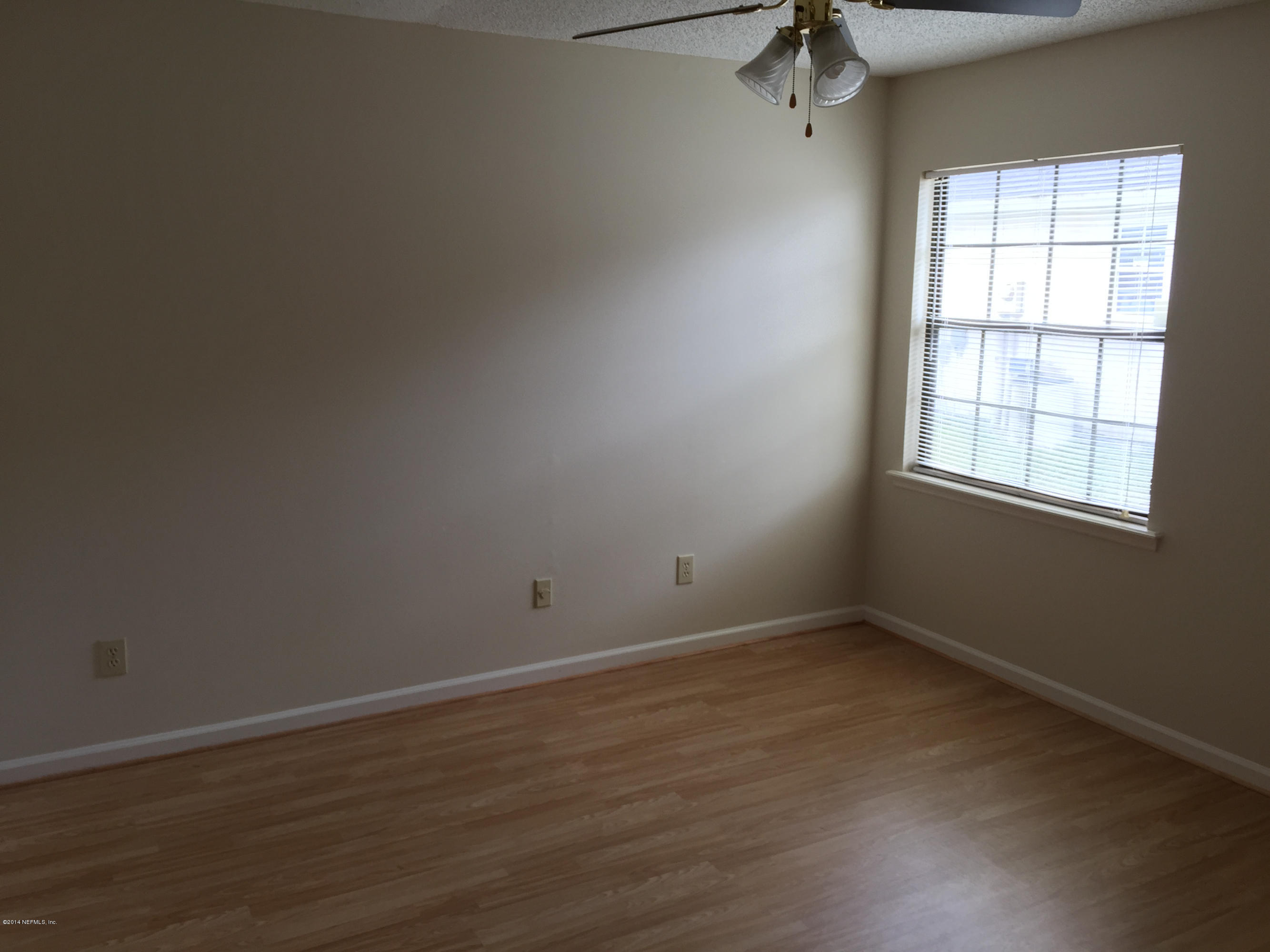 6408 Checkmate Lane Jacksonville, FL 32244 - Photo 13 of 18 an empty room with a window