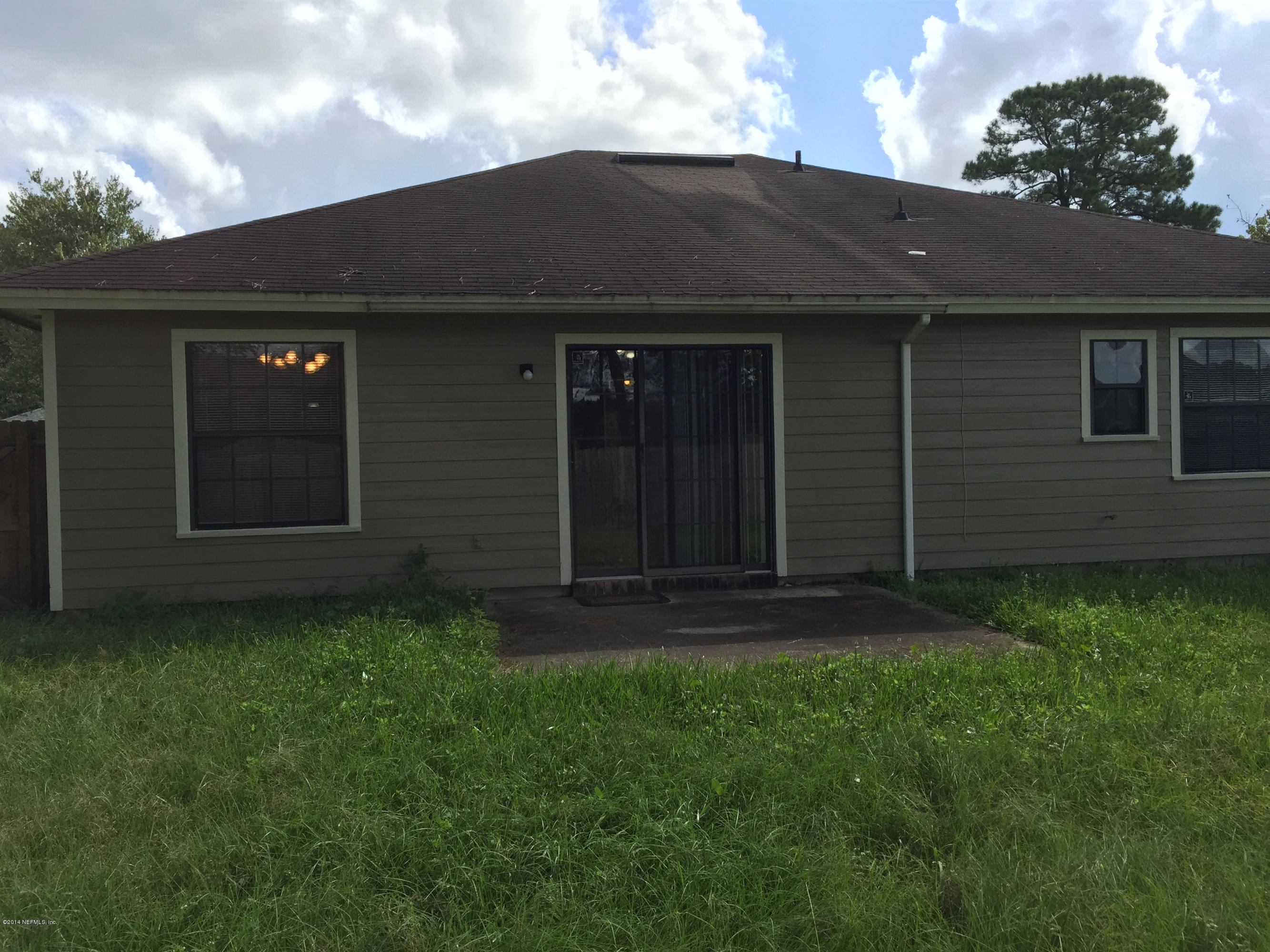 6408 Checkmate Lane Jacksonville, FL 32244 - Photo 16 of 18 a view of front of a house with a yard