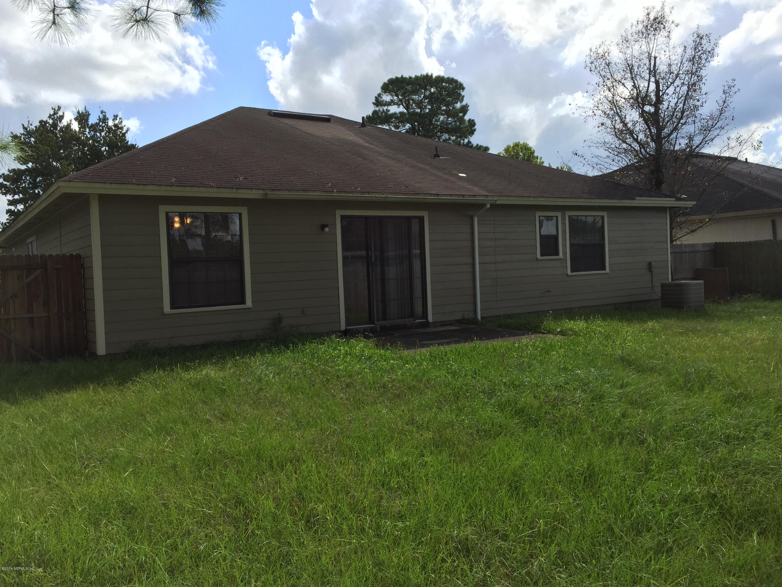 6408 Checkmate Lane Jacksonville, FL 32244 - Photo 17 of 18 a view of a house with a garden