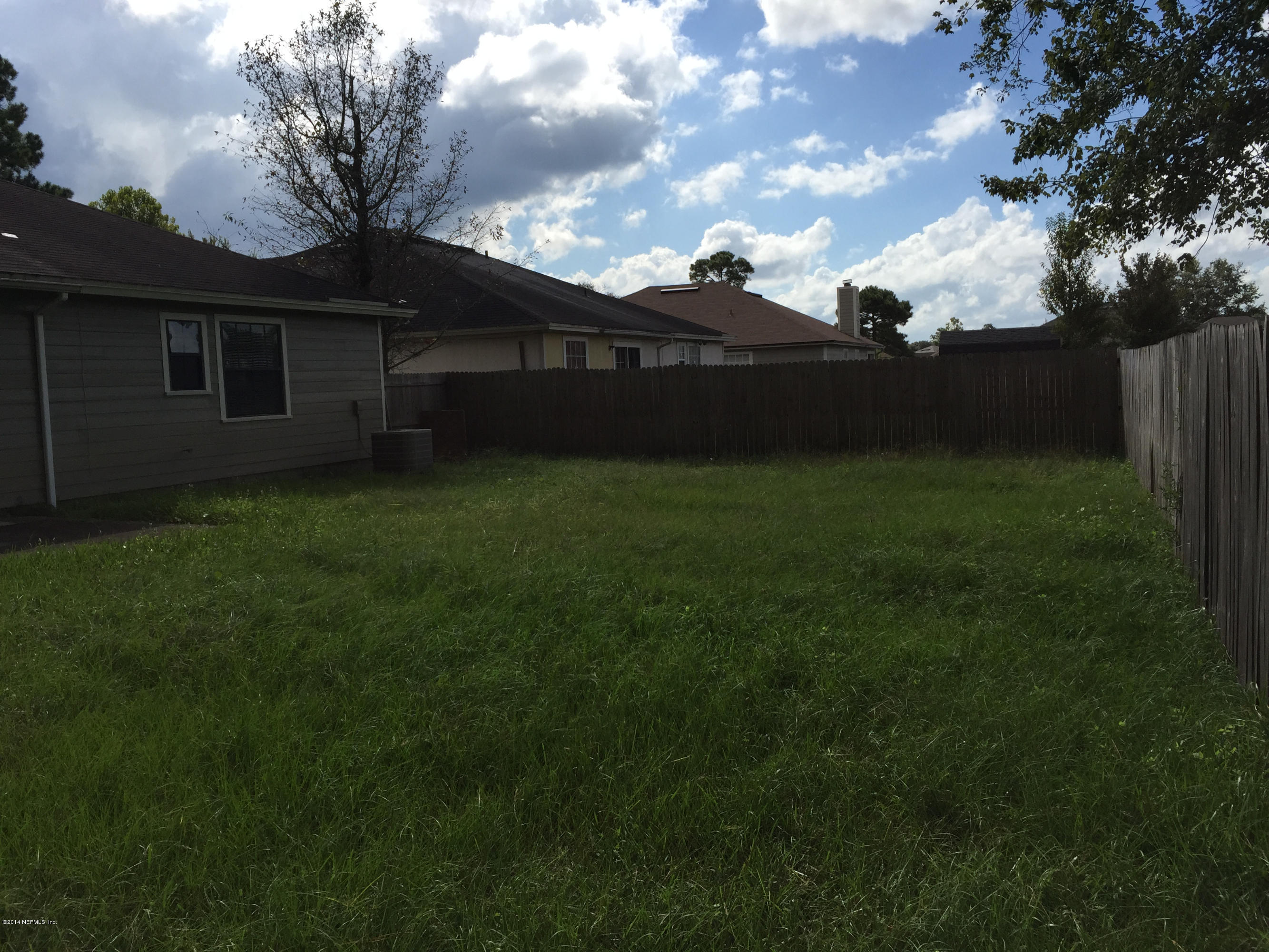 6408 Checkmate Lane Jacksonville, FL 32244 - Photo 18 of 18 a fire hydrant in the middle of a field