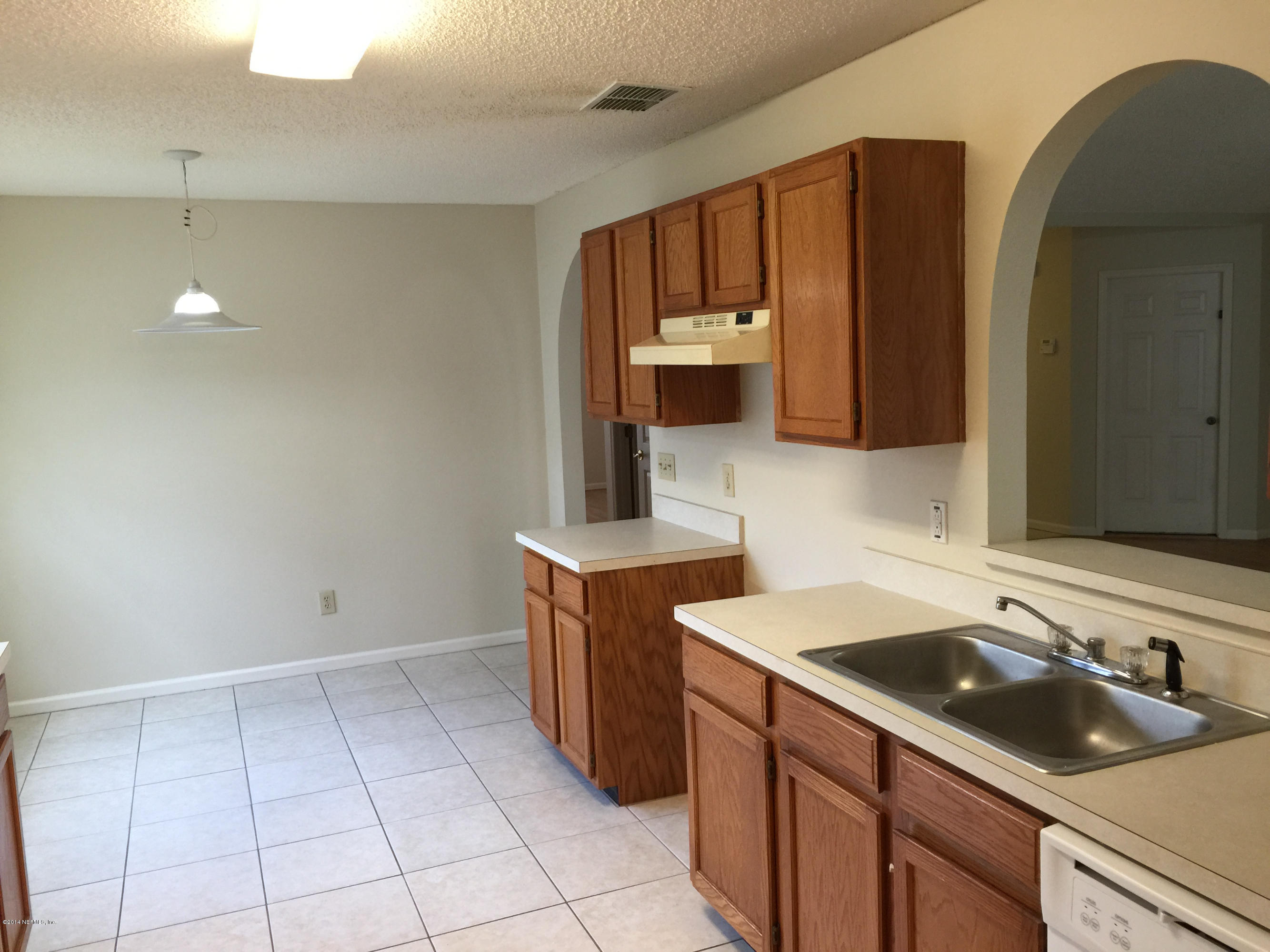 6408 Checkmate Lane Jacksonville, FL 32244 - Photo 7 of 18 a kitchen with a sink and cabinets