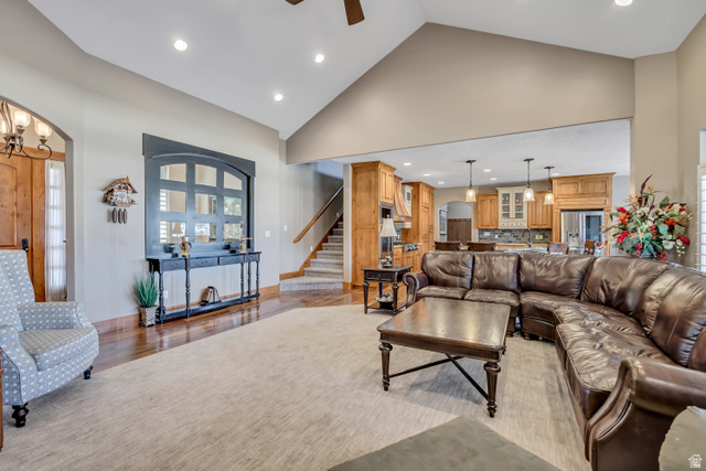 896 West 675 South Mapleton, UT 84664 - Photo 5 of 77 Living room featuring high vaulted ceiling, recessed lighting, stairway, arched walkways, and light wood-type flooring