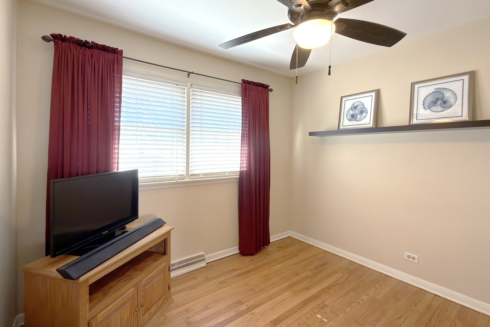 62 Mayer Avenue Wheeling, IL 60090 - Photo 11 of 20 a bedroom with window and flat screen tv
