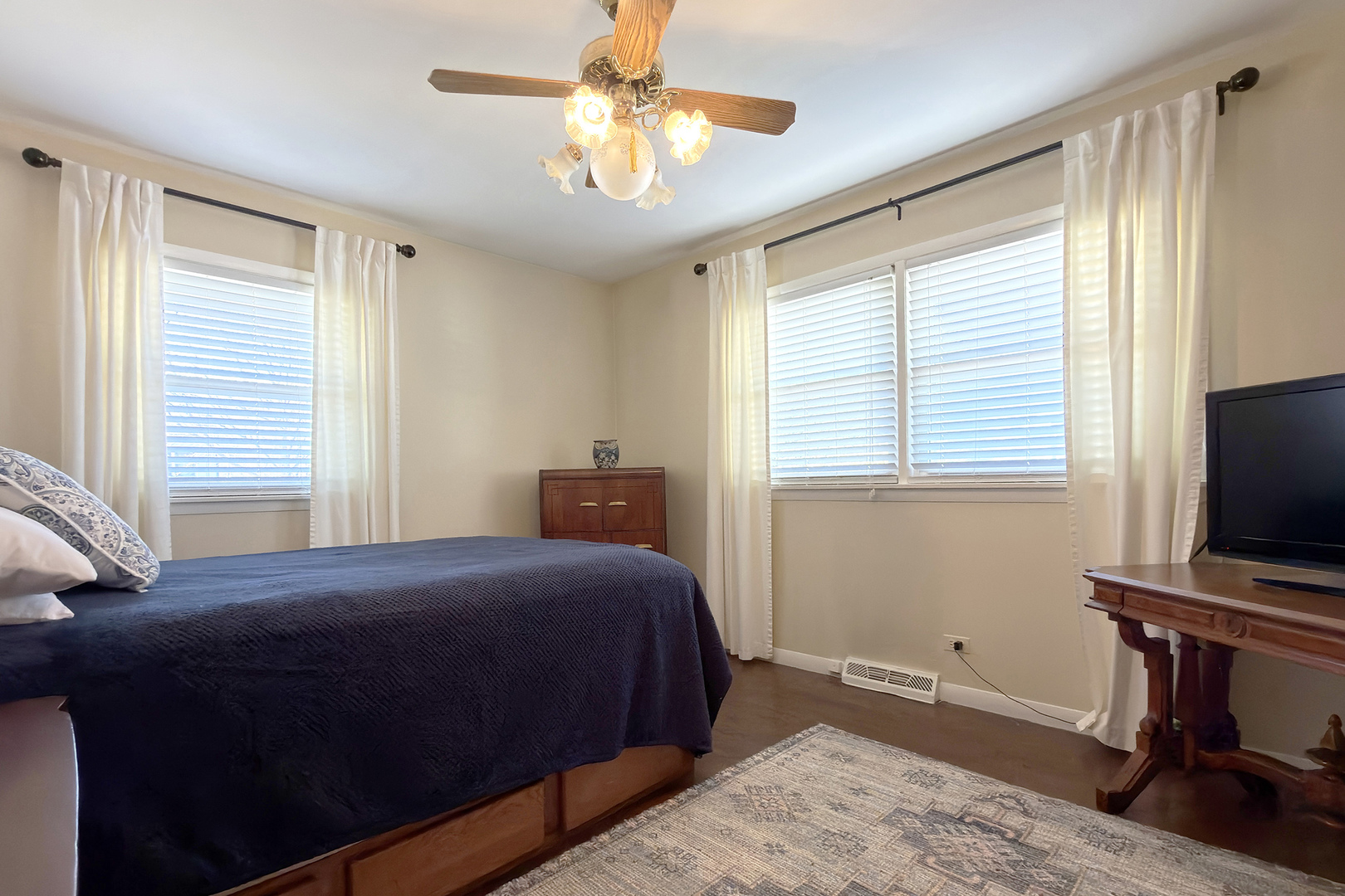 62 Mayer Avenue Wheeling, IL 60090 - Photo 12 of 20 a bedroom with a bed and a flat screen tv