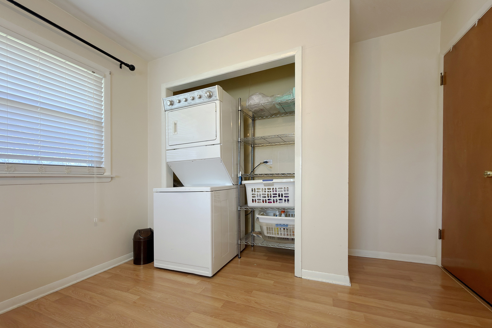 62 Mayer Avenue Wheeling, IL 60090 - Photo 14 of 20 an empty room with wooden floor and cabinet
