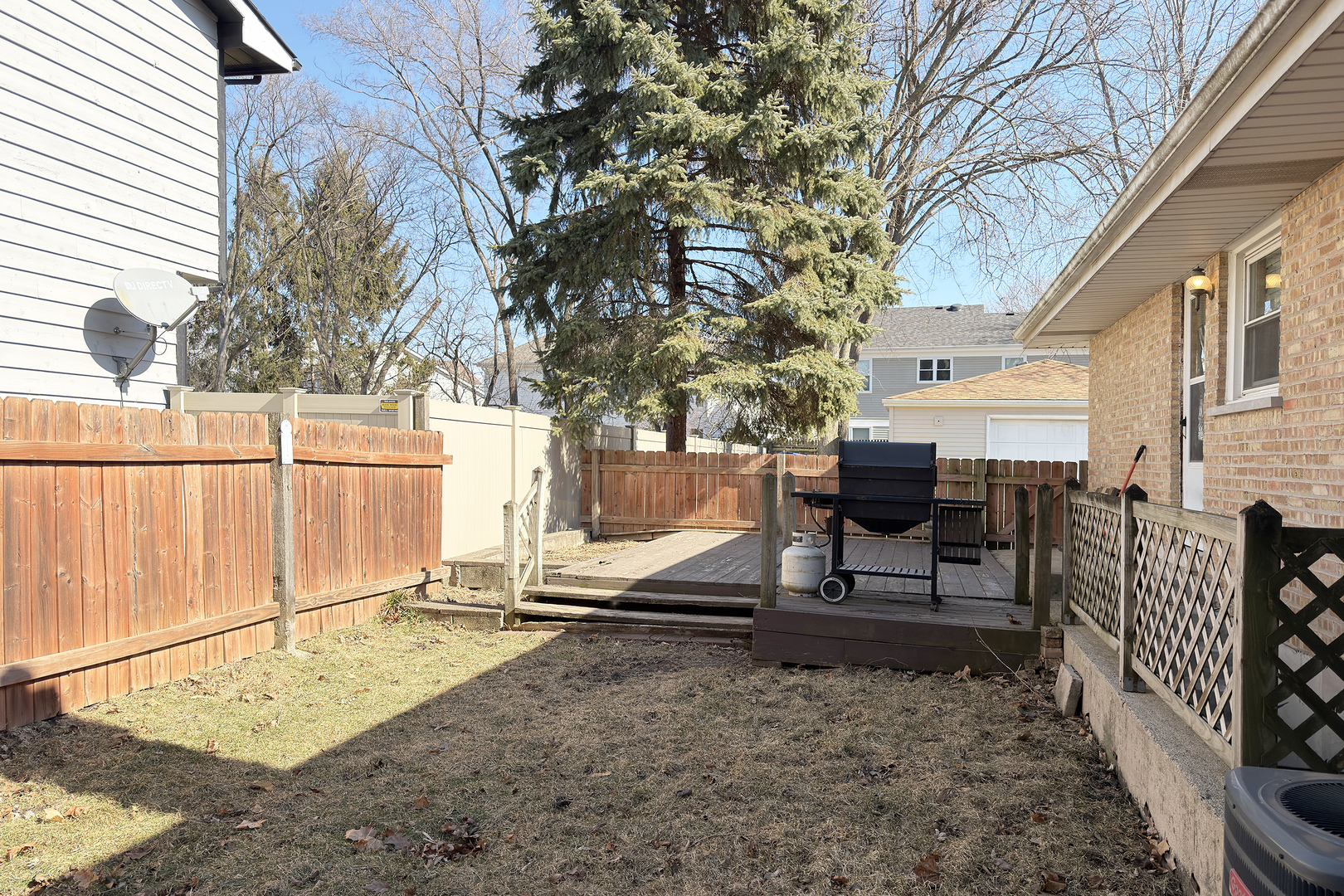 62 Mayer Avenue Wheeling, IL 60090 - Photo 17 of 20 a house with trees in front of it