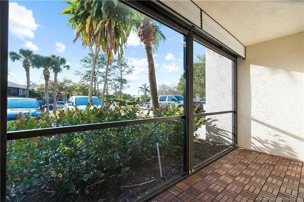 a view of a balcony with wooden floor