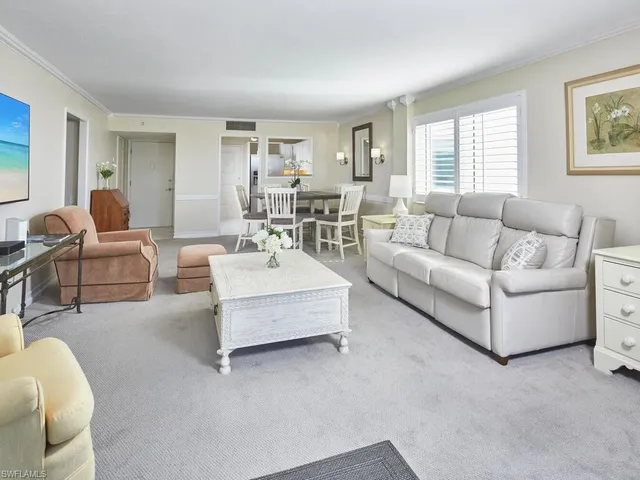 a spacious bedroom with a bed and a large window