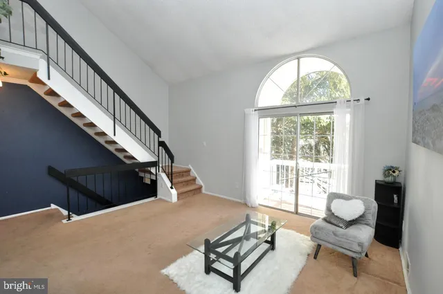 a living room with furniture and a windows