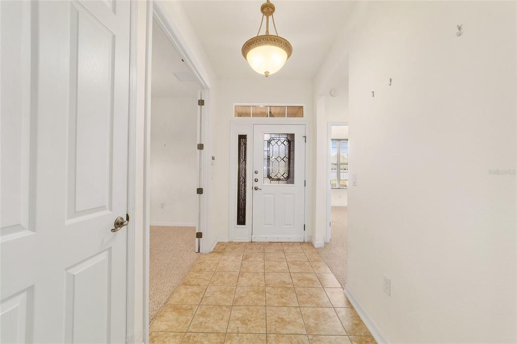 8434 Southwest 82nd Loop Ocala, FL 34481 - Photo 11 of 41 a view of a room with wooden floor and windows