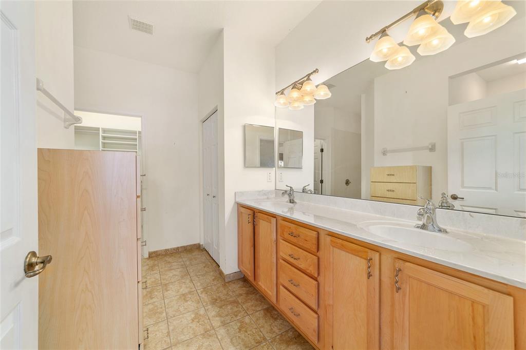 8434 Southwest 82nd Loop Ocala, FL 34481 - Photo 27 of 41 a bathroom with a double vanity sink mirror and double