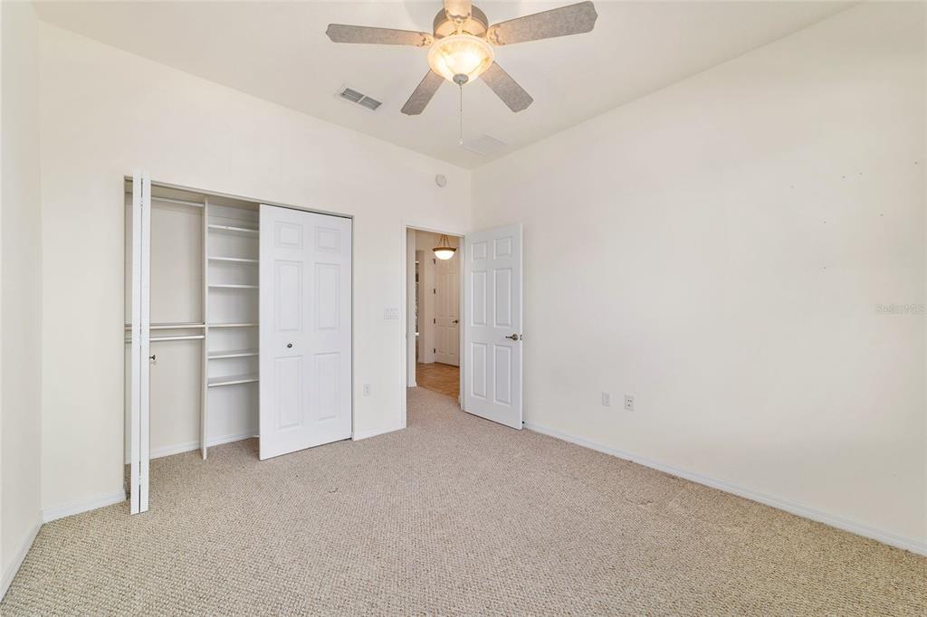 8434 Southwest 82nd Loop Ocala, FL 34481 - Photo 32 of 41 a view of an empty room and chandelier fan