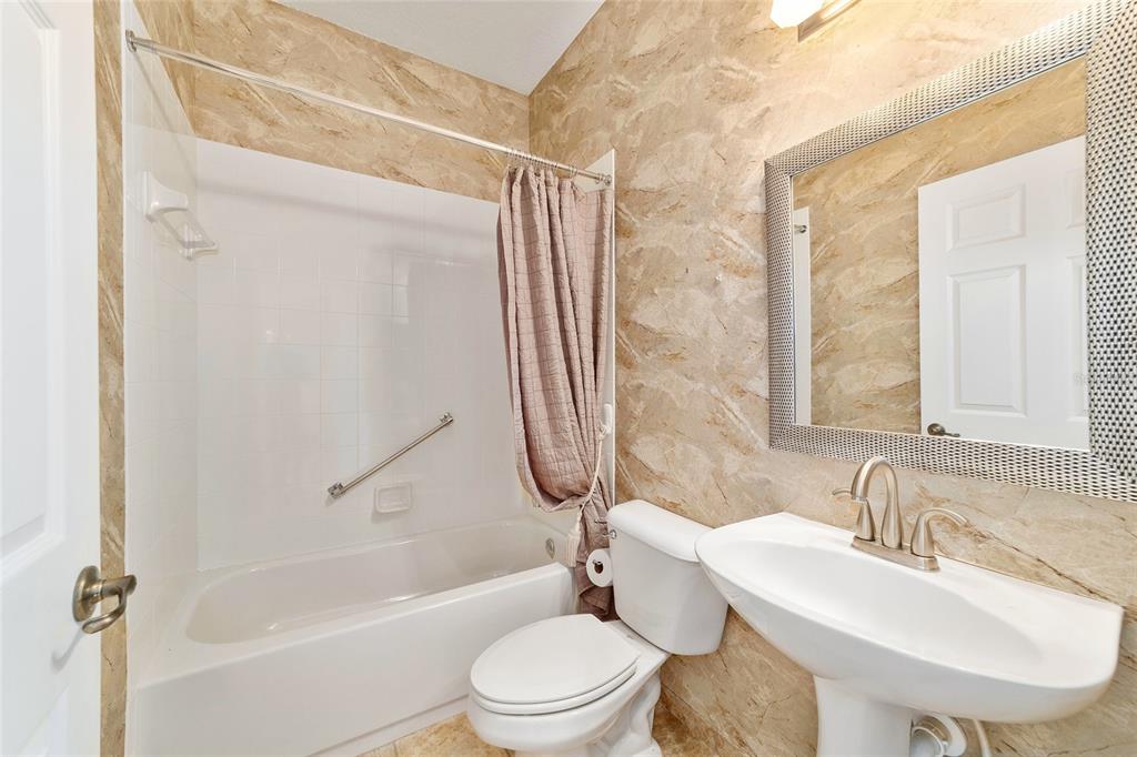 8434 Southwest 82nd Loop Ocala, FL 34481 - Photo 34 of 41 a bathroom with a sink toilet and shower