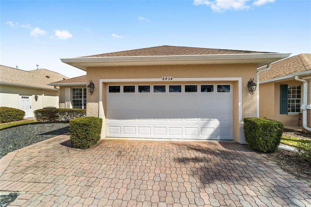 8434 Southwest 82nd Loop Ocala, FL 34481 - Photo 7 of 41 a front view of a house