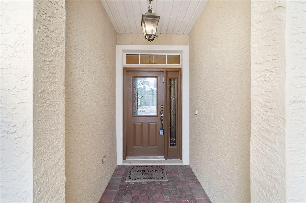 8434 Southwest 82nd Loop Ocala, FL 34481 - Photo 9 of 41 a view of a hallway with wooden floor