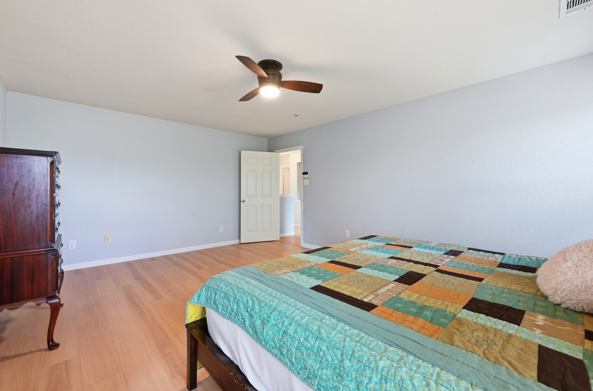 2700 Cradlerock Terrace Austin, TX 78748 - Photo 19 of 29 a bedroom with a bed and a dresser