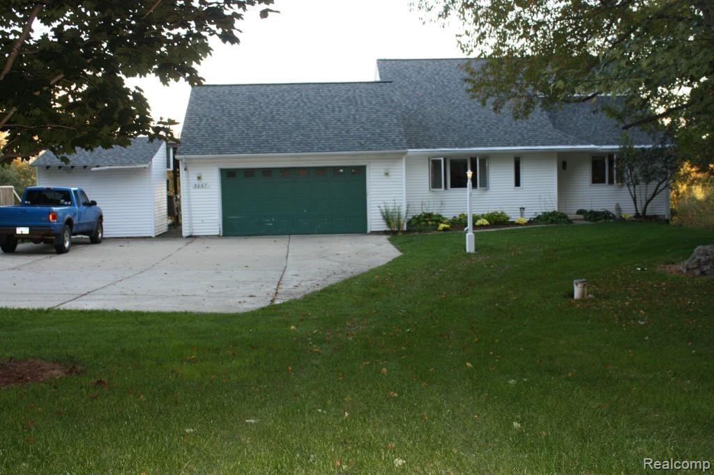 5067 Mason Road Howell, MI 48843 - Photo 1 of 43 Front of home, concrete Driveway, heated 2 - car attached garage