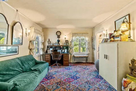 a bathroom with a sink mirror and toilet