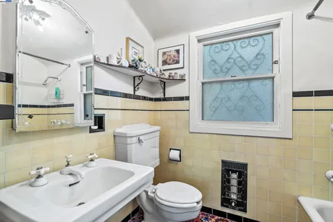 a kitchen with cabinets and window