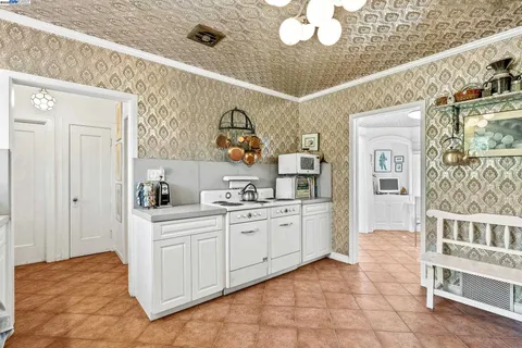 a kitchen with a sink and cabinets