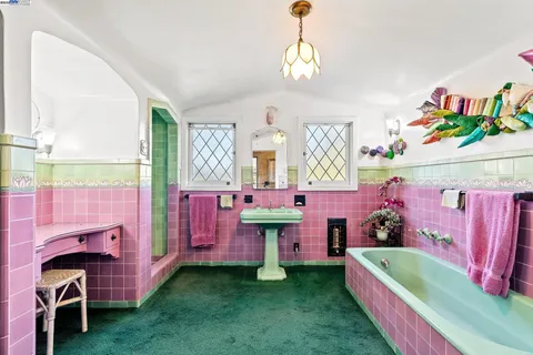 a bedroom with a large bed and a couch