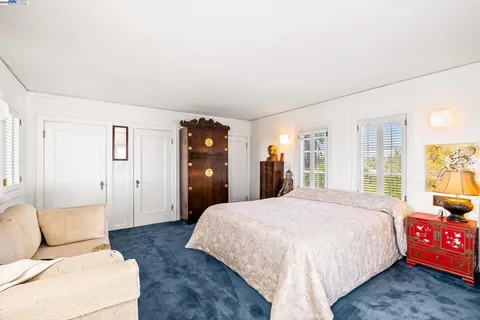 a view of a patio with table and chairs potted plants