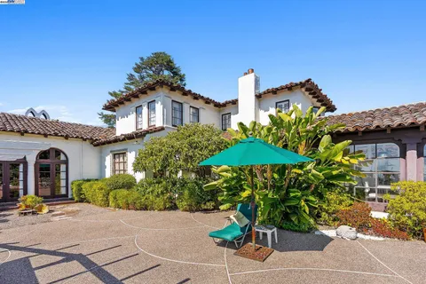 a view of a house with a small yard and plants
