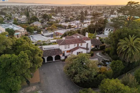 an aerial view of multiple houses with yard