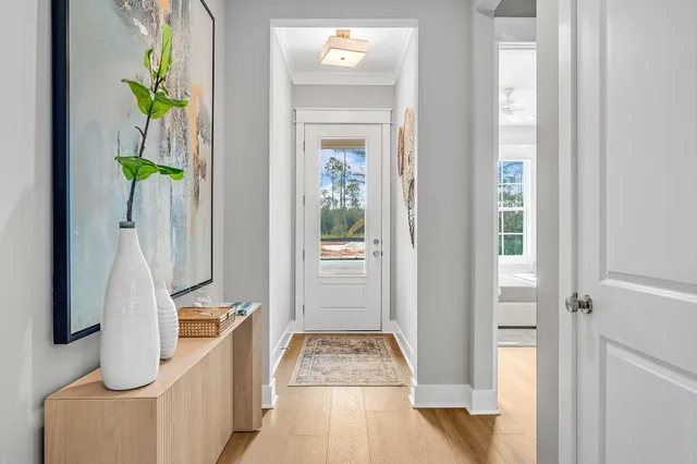 a view of an entryway with wooden floor