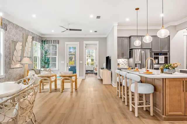 a large kitchen with a table and chairs