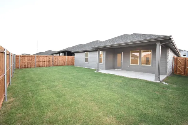 a front view of a house with yard
