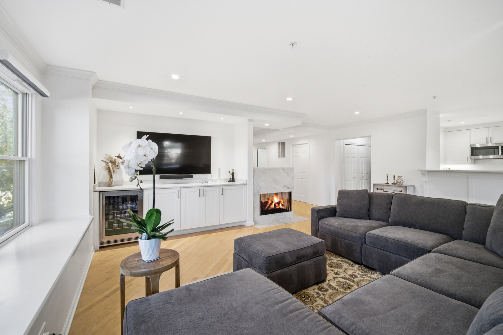 1688 Green Bay Road, Unit 204 Highland Park, IL 60035 - Photo 6 of 14 a living room with furniture and a flat screen tv