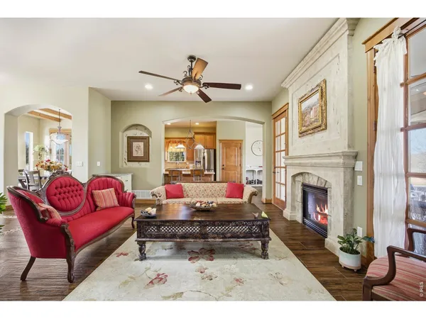 a dining room with furniture window and wooden floor