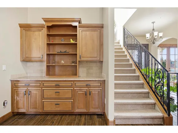 a kitchen with a sink stove and cabinets