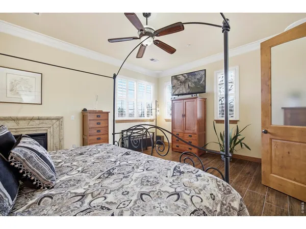 a bedroom with furniture and a chandelier
