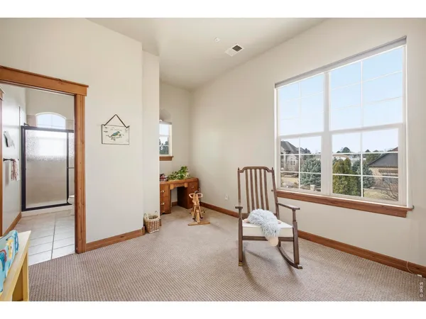 a bathroom with a granite countertop sink a large mirror and a shower